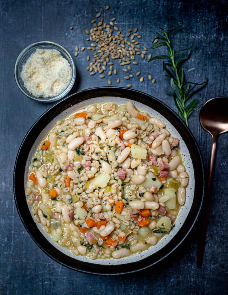 Photo of bowl with white minestrone soup with beans