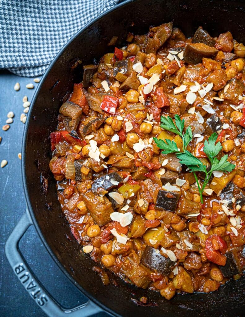 A photo of a pn with aubergine tagine