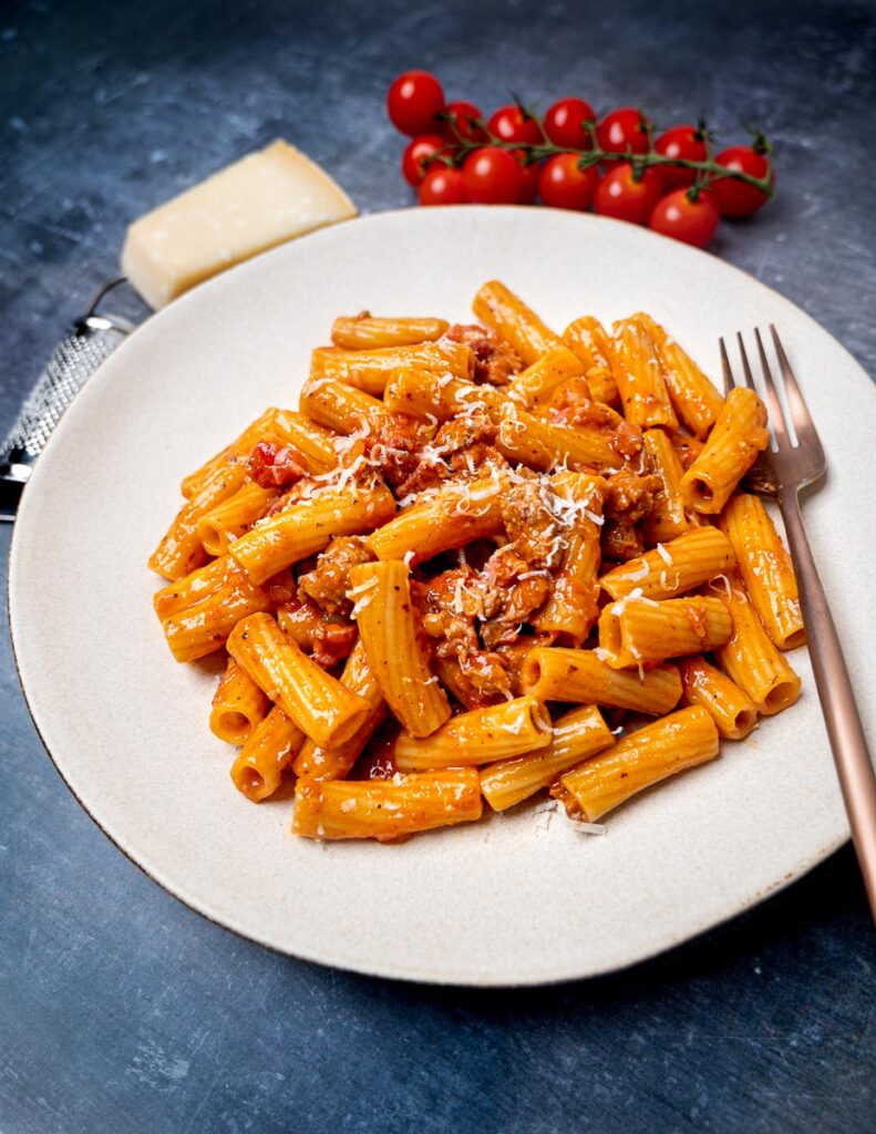 A plate of pasta alla zozzona with a fork on the side