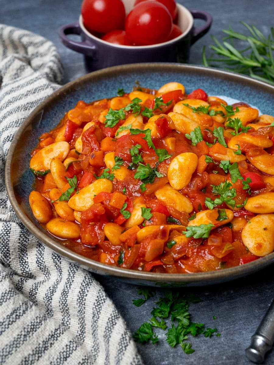 Mediterranean white bean dish with tomatoes on the side