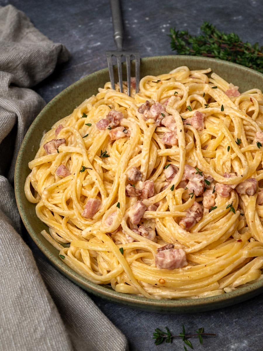 A bowl of pasta with pancetta and Philadelphia