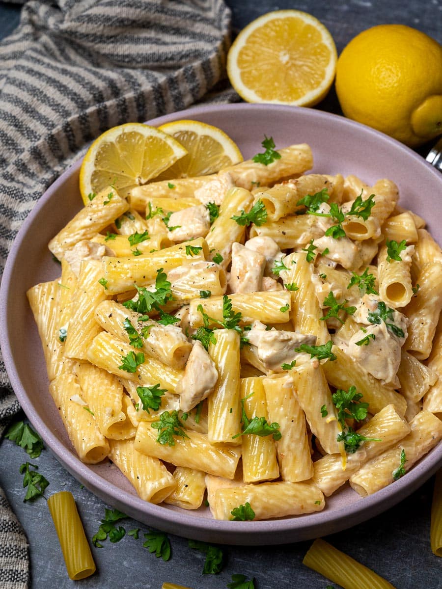 A bowl of lemon rigatoni with parsley on top