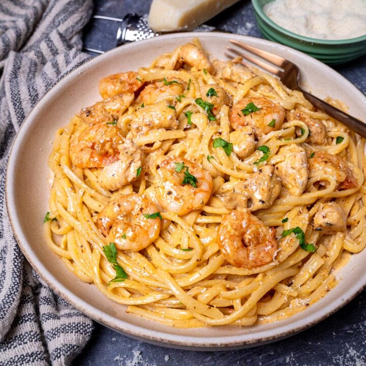 A plate of chicken and shrimp pasta