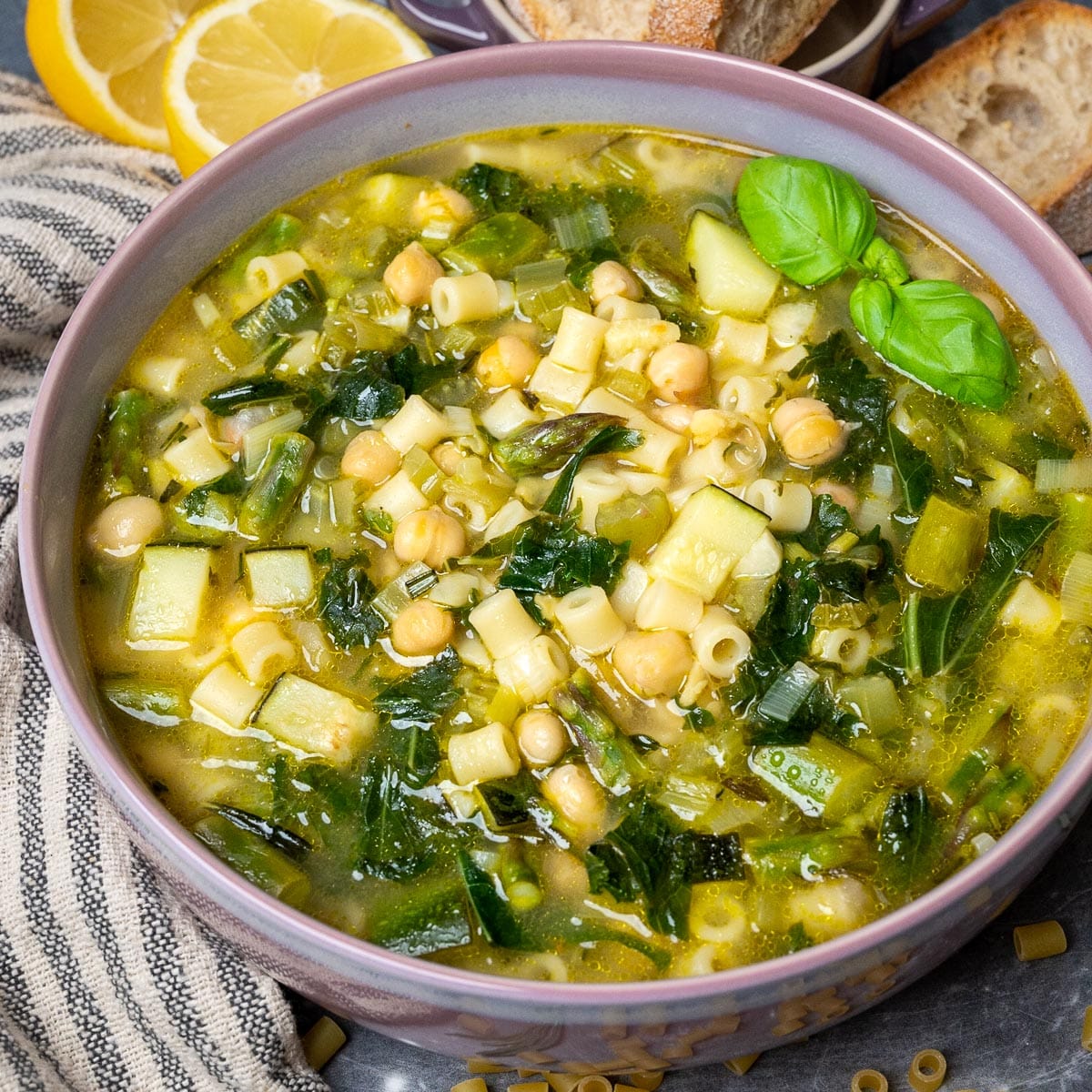 A bowl of spring minestrone soup with chickpeas and pasta
