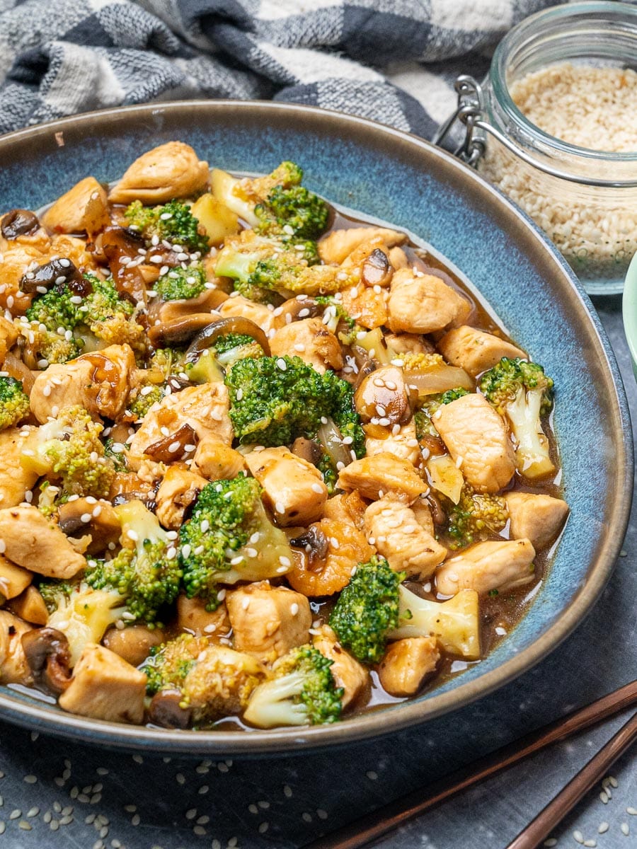 a plate of a chicken and broccoli stir fry