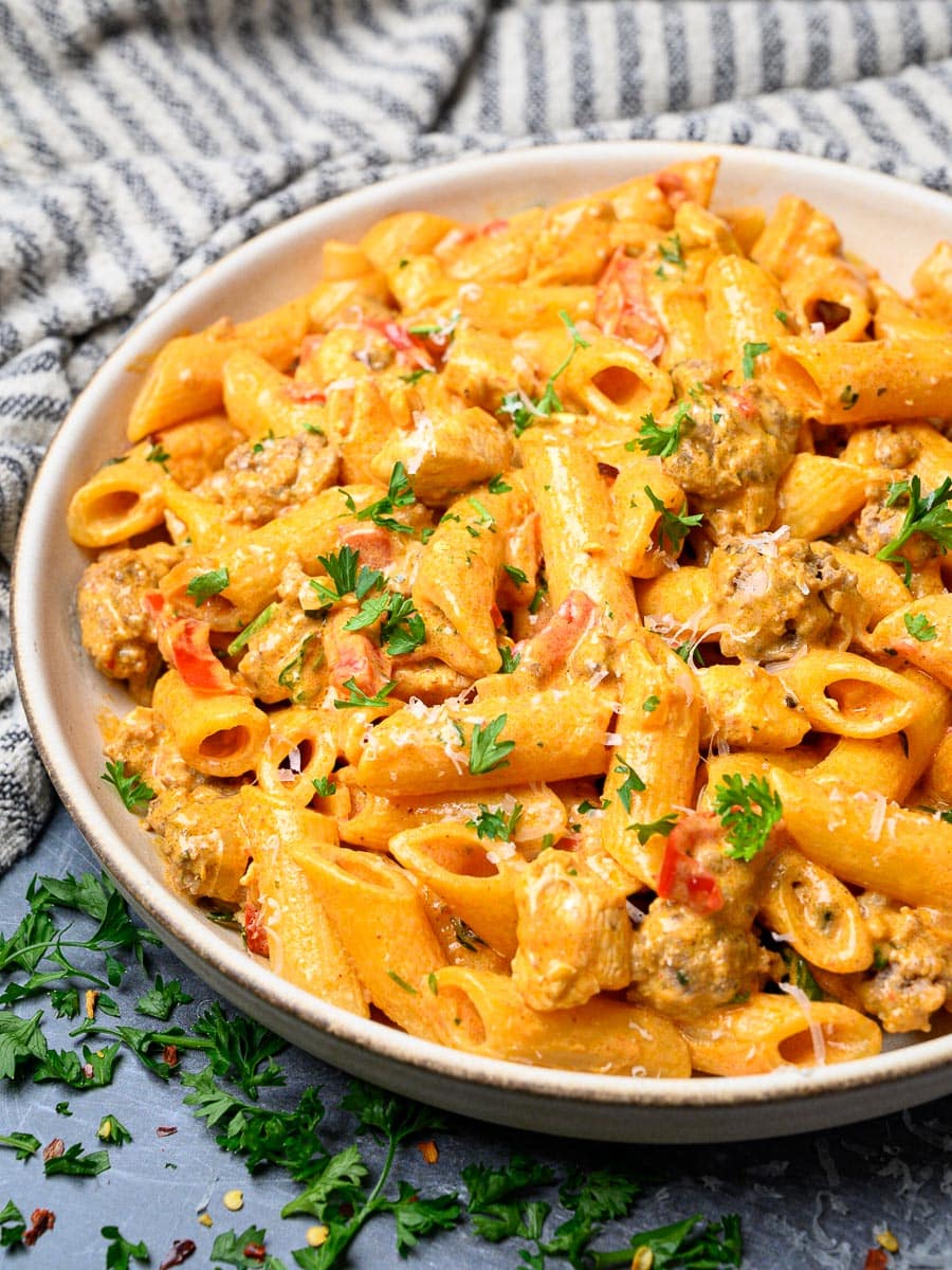 a plate of chicken and sausage pasta