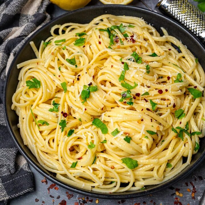 A plate of pasta with lemon butter and garlic sauce