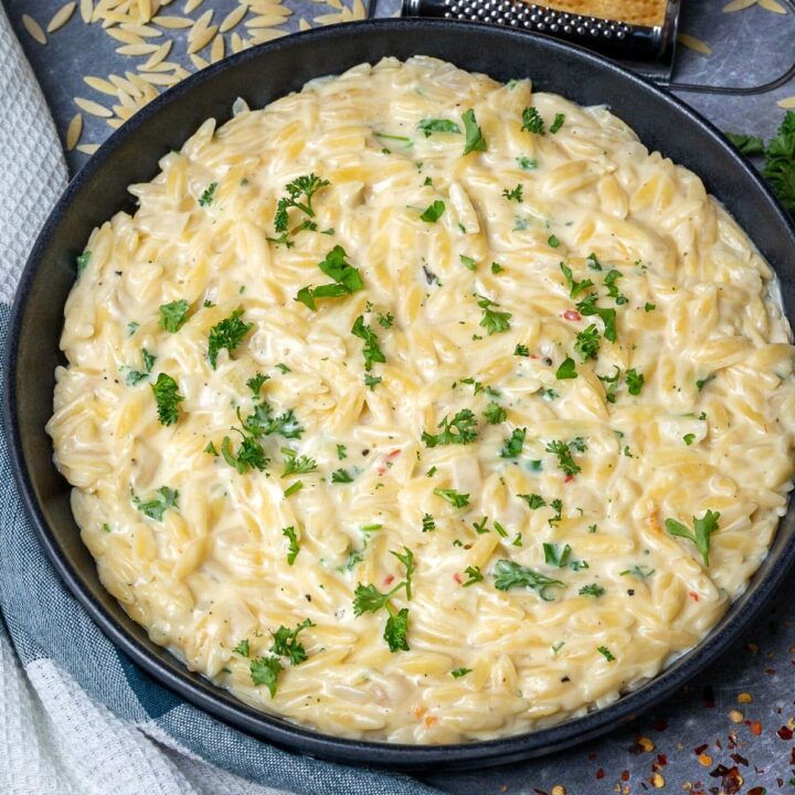 a plate with garlic parmesan orzo