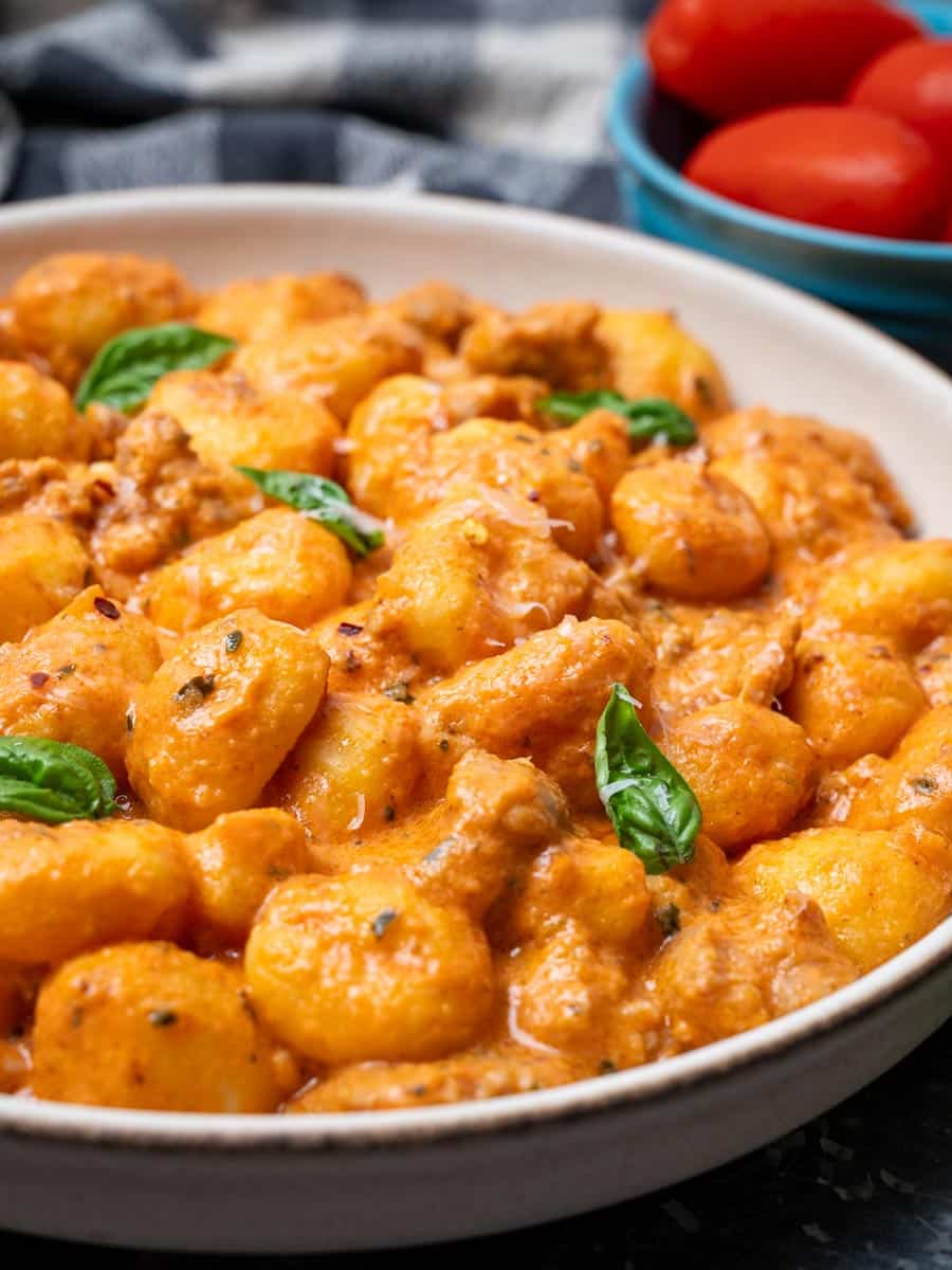 Close-up photo of a bowl of gnocchi with Italian sausage
