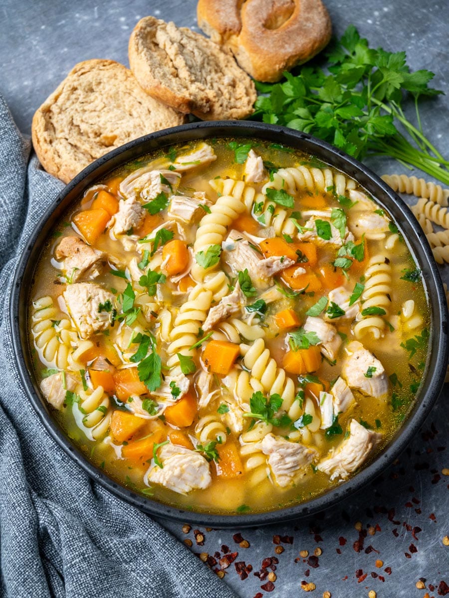 A bowl of soup made with leftover turkey and noodles.