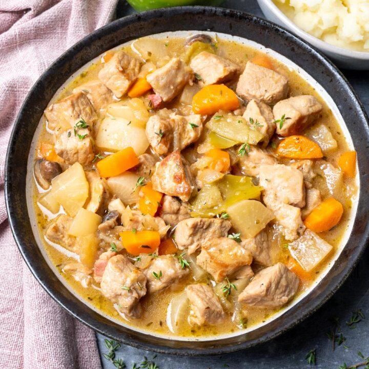 A bowl of pork and apple casserole.