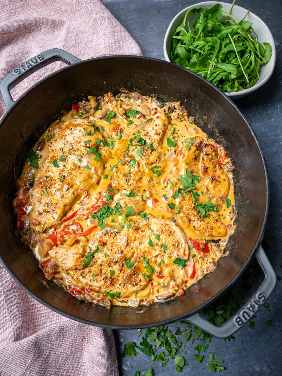 a pan with chicken and peppers