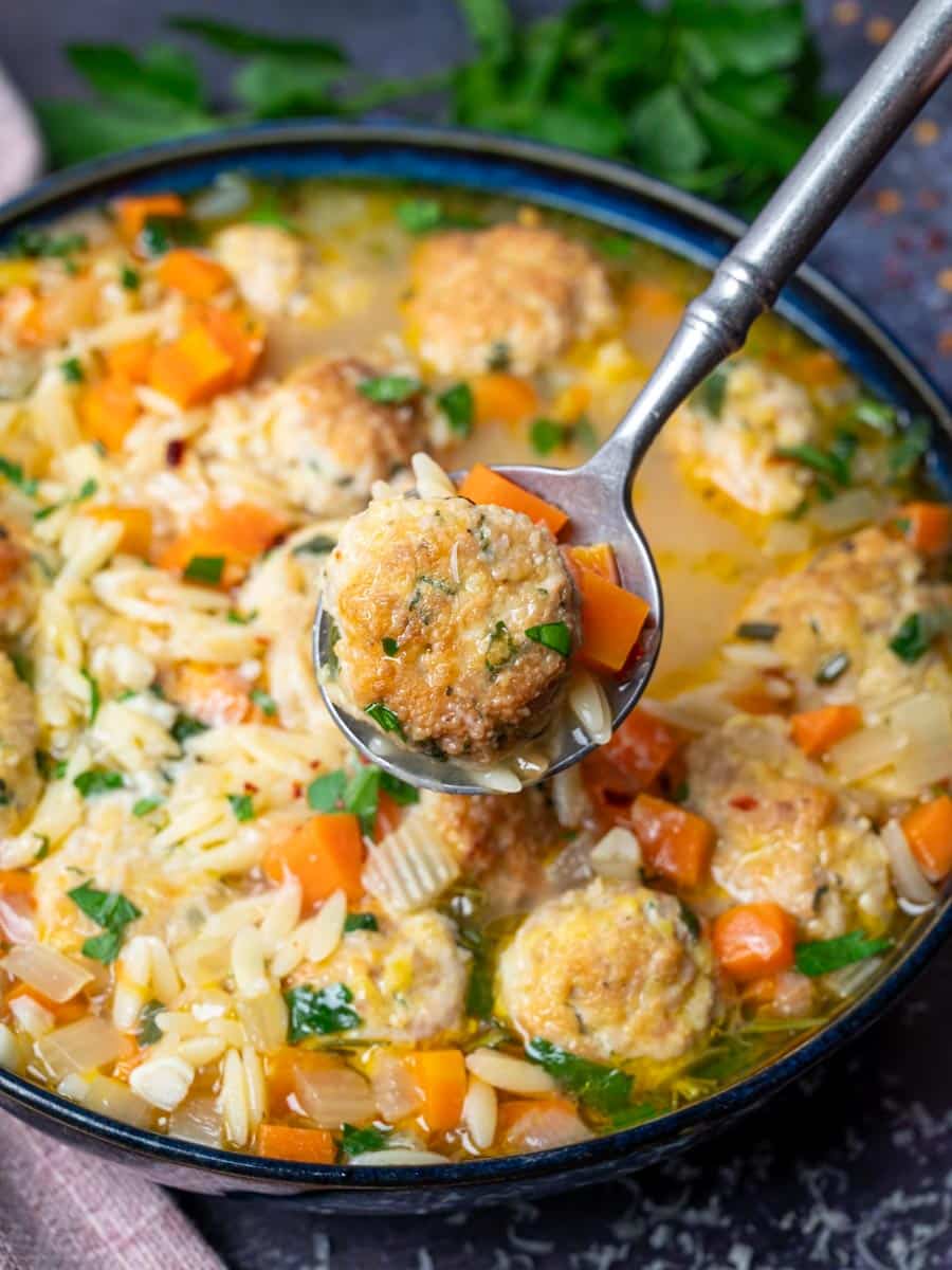 close up photo of a chicken meatball soup