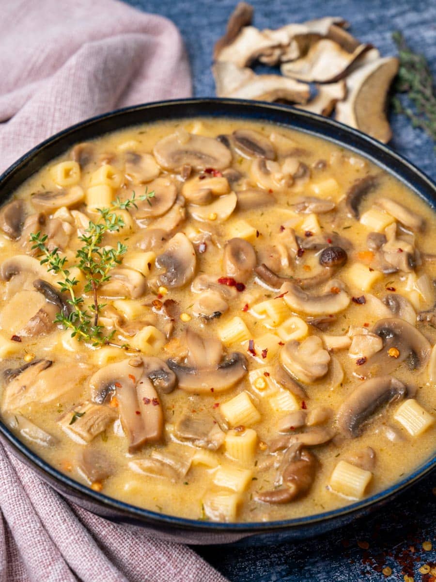 a bowl of mushroom pasta soup