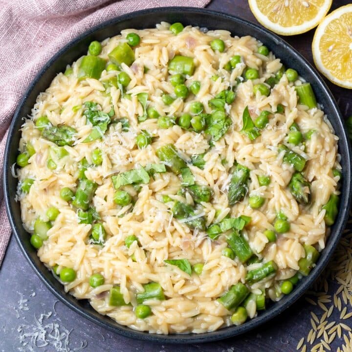 A bowl of asparagus and peas orzo