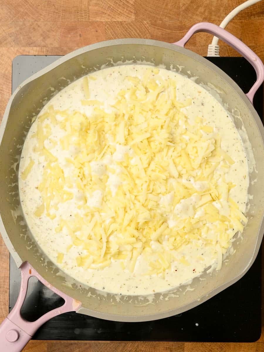adding cheese to an American dish