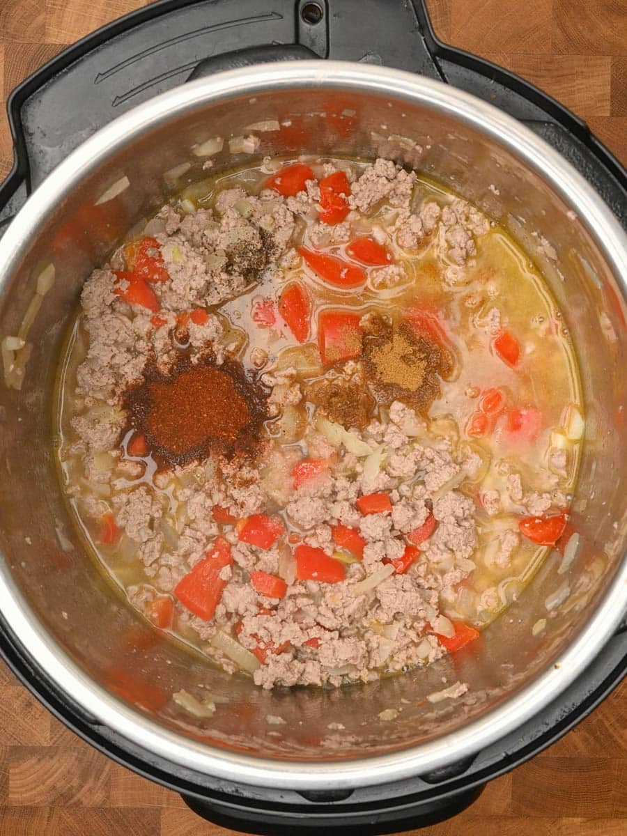 adding spices to an American dish