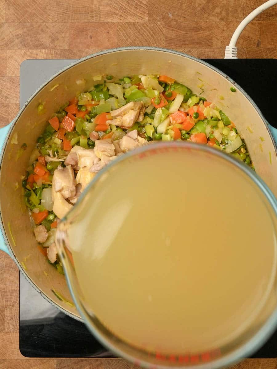 adding stock to a chicken split pea soup