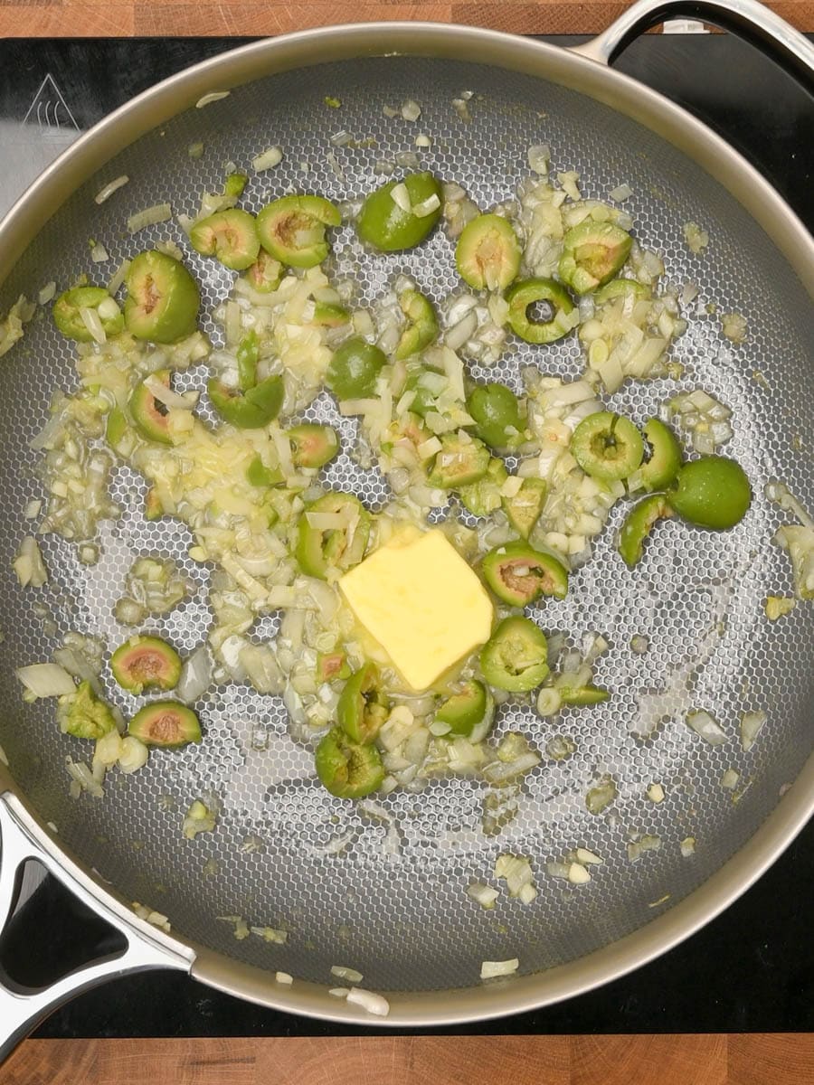 adding butter to an American dish