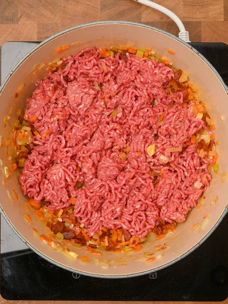 adding beef to a chorizo bolognese