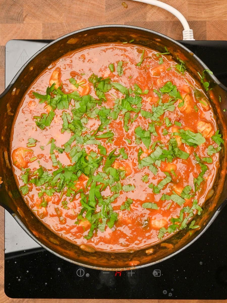 adding coriander to an Asian dish