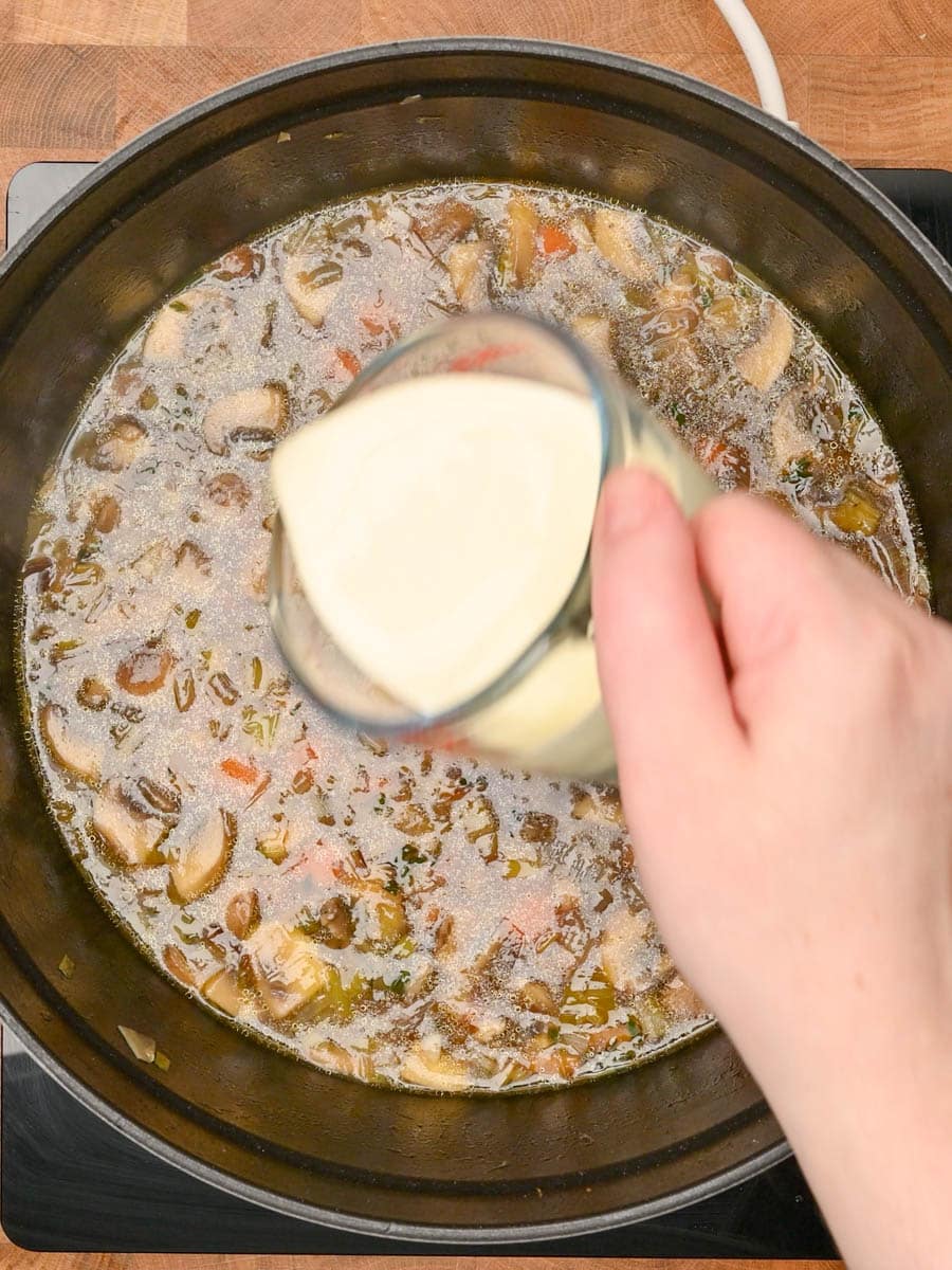 adding heavy cream to an American dish
