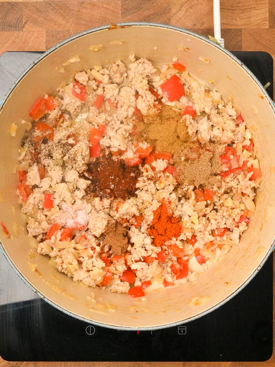 adding spices to an American dish