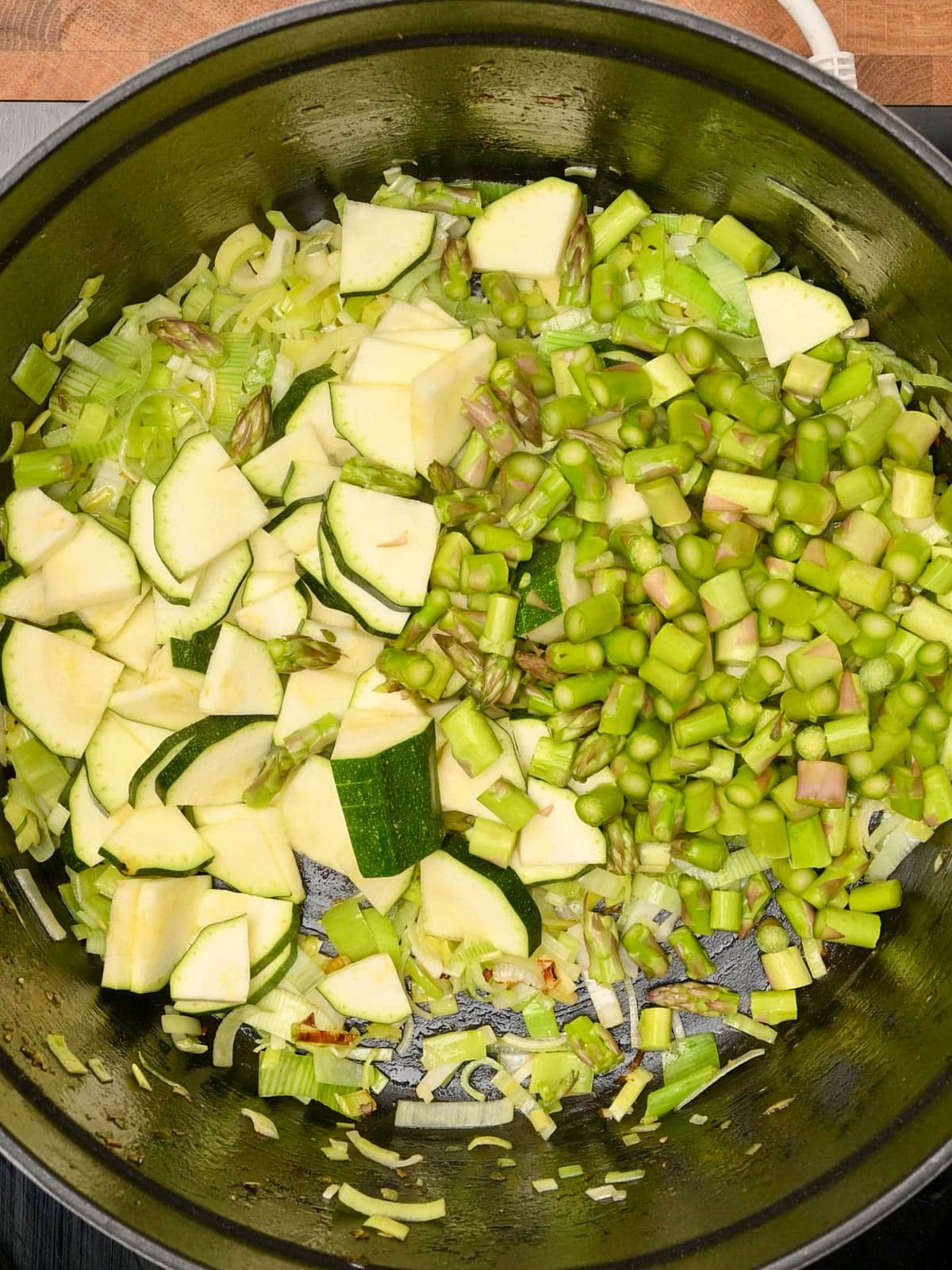 adding zucchini and peas to Chicken Pasta Primavera
