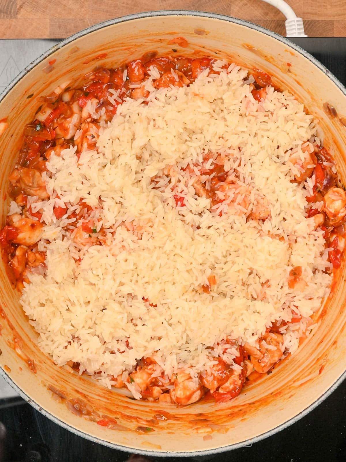 chicken and chorizo rice cooking in the pot