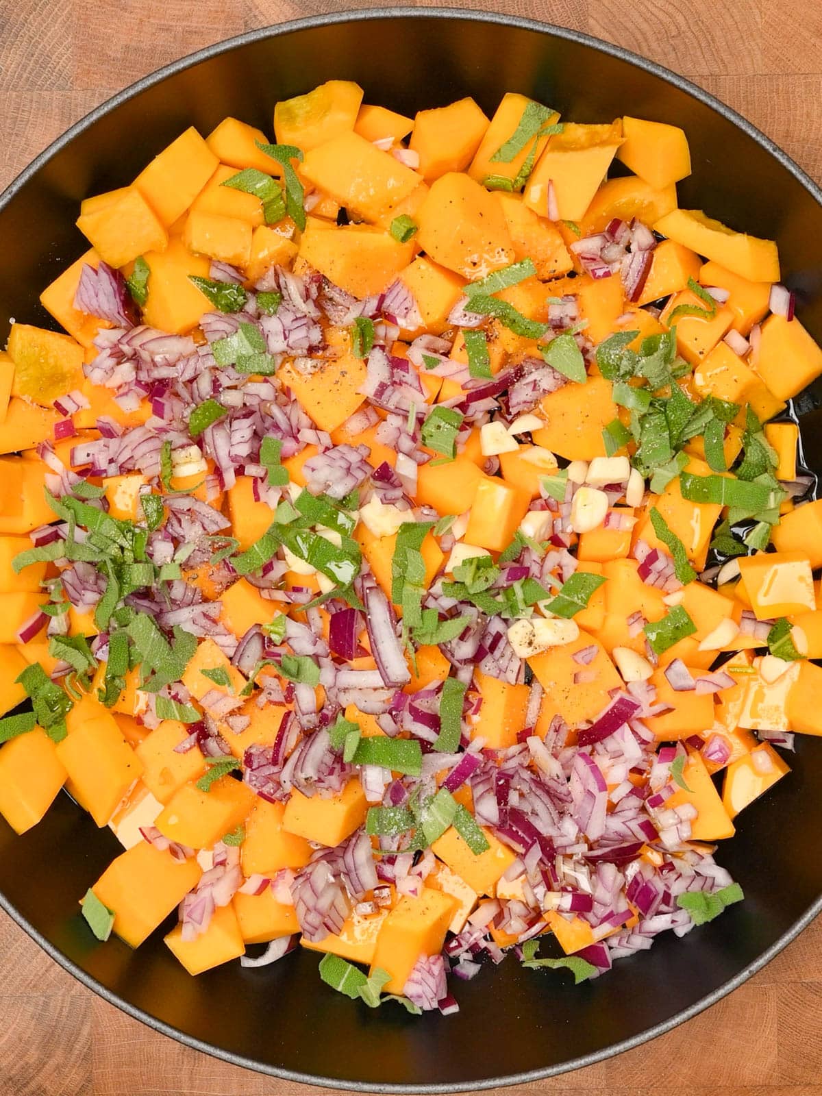 adding onion, garlic and sage to butternut squash gnocchi