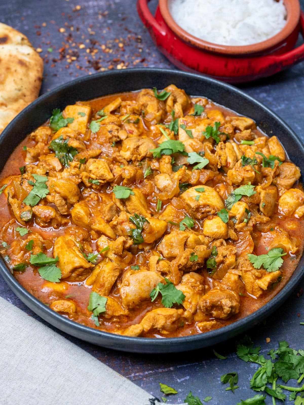 chicken vindaloo with coriander on top