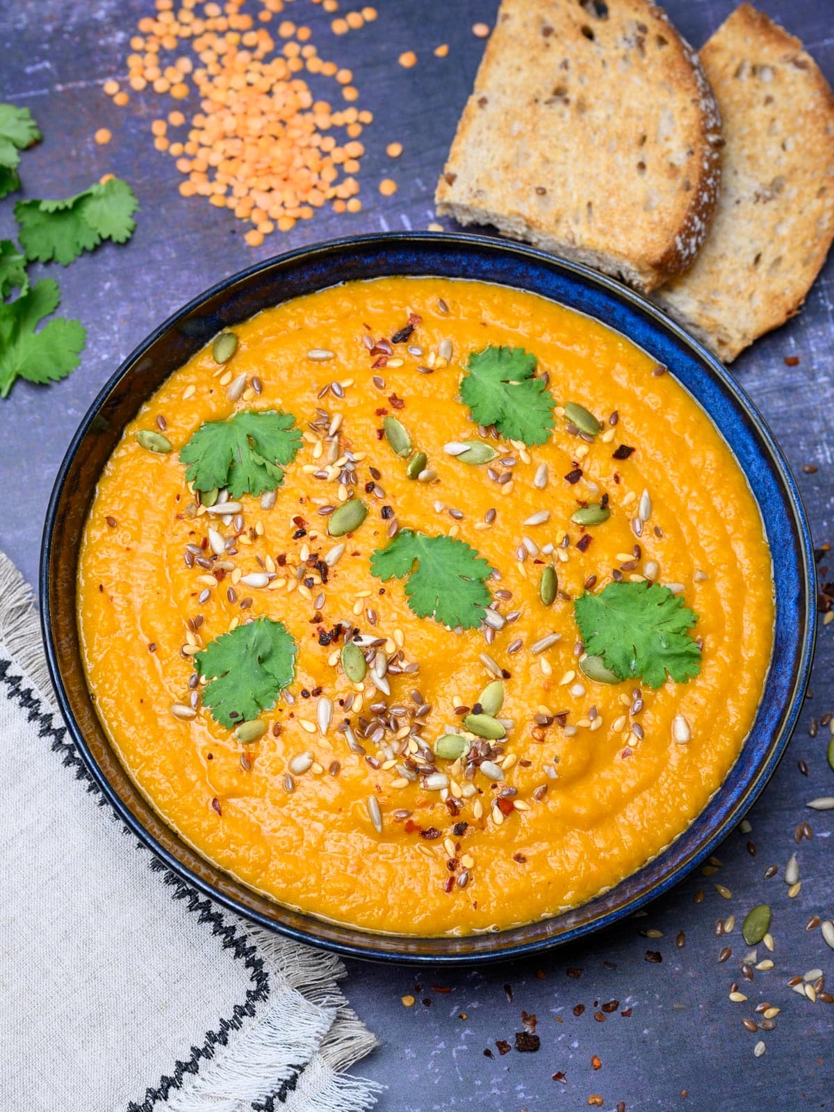 a bowl of a carrot and lentil soup
