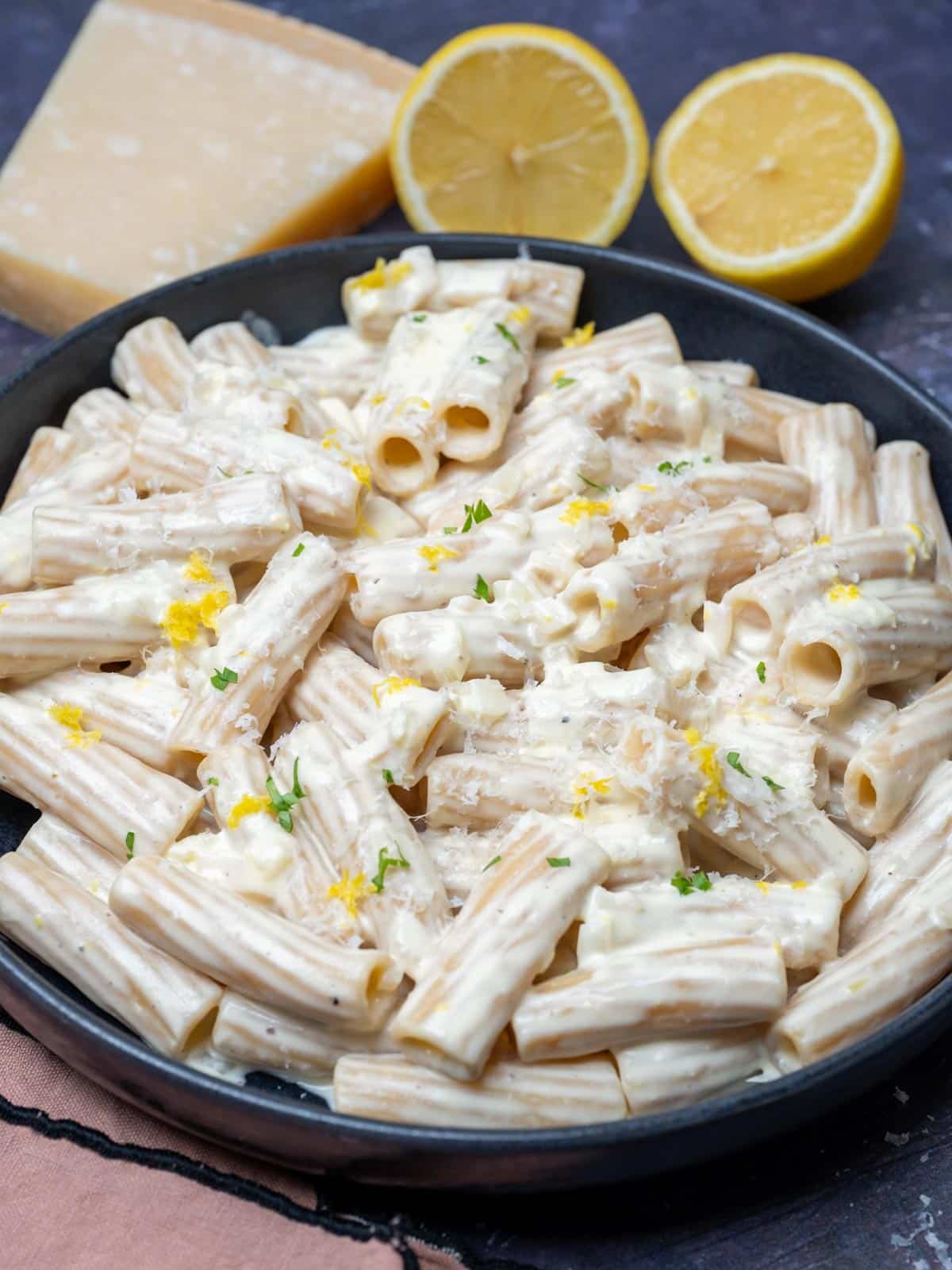 Creamy Lemon Pasta Sauce with lemons on the side
