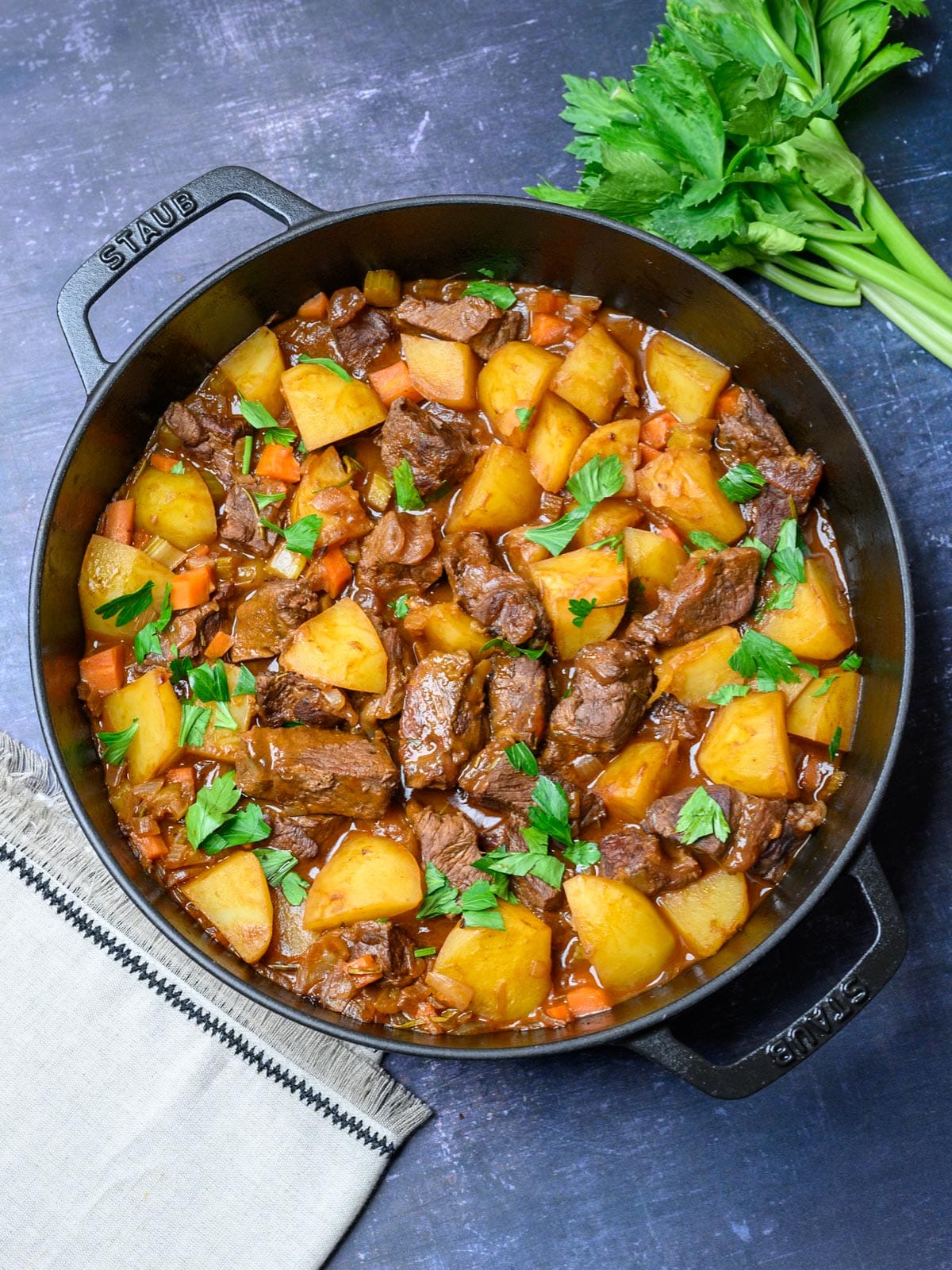 italian beef stew in a black pan