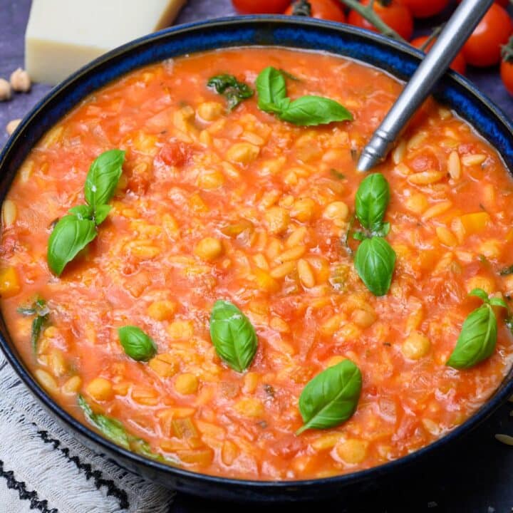 bowl of soup with basil on top